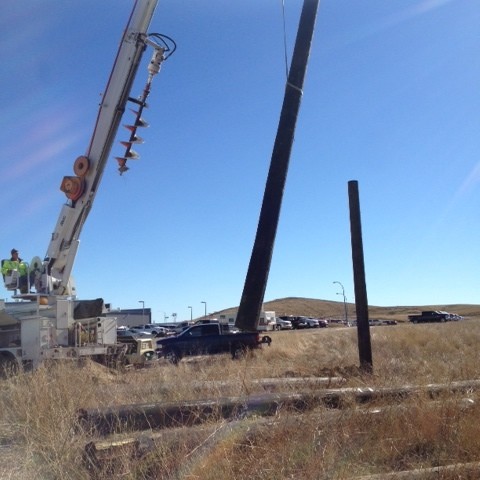 Setting up billboard poles in Laurel MT